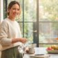 Healthy woman in kitchen for September health reset